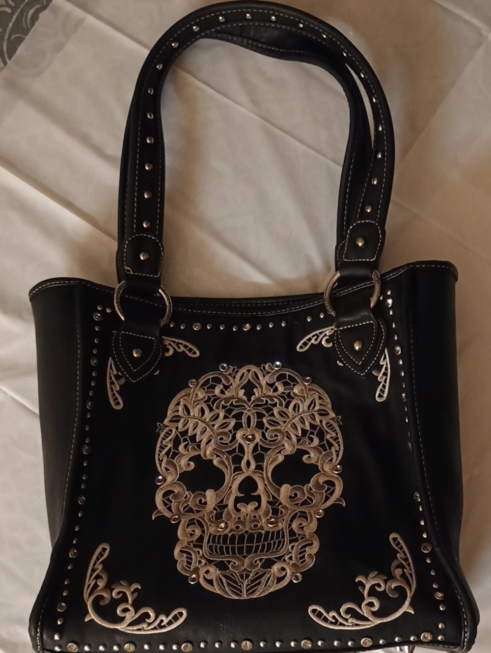 Montana West Brand. Black Studded Tote with Ornate Silver Skull Embroidery